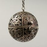 A CHINESE PIERCED SILVER BALL CENSER.