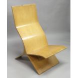 IN THE MANNER OF ISIKON, a moulded plywood chair, formed in two parts.