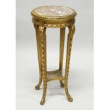 A 19TH CENTURY FRENCH GILTWOOD CIRCULAR STAND with inset marble top, curving legs with cane inset.