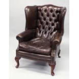 A GOOD GEORGE III DESIGN BROWN LEATHER, BUTTON UPHOLSTERED WING ARMCHAIR, on cabriole legs.