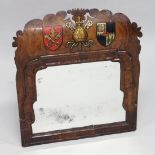 A SMALL 18TH CENTURY WALNUT FRAMED MIRROR with shaped fretwork top, the mirror plate within a