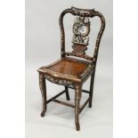 A CHINESE ROSEWOOD AND MOTHER OF PEARL SINGLE CHAIR with solid seat.