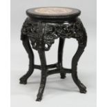 A 19TH CENTURY CHINESE ROSEWOOD AND MARBLE INSET CIRCULAR URN STAND,with pierced and carved apron,
