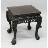 A 19TH CENTURY CHINESE ROSEWOOD SQUARE STAND, with pierced and carved apron on carved cabriole legs.