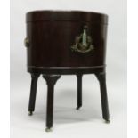 A VERY GOOD GEORGE III MAHOGANY OVAL WINE COOLER with crossbanded rising top opening to reveal a