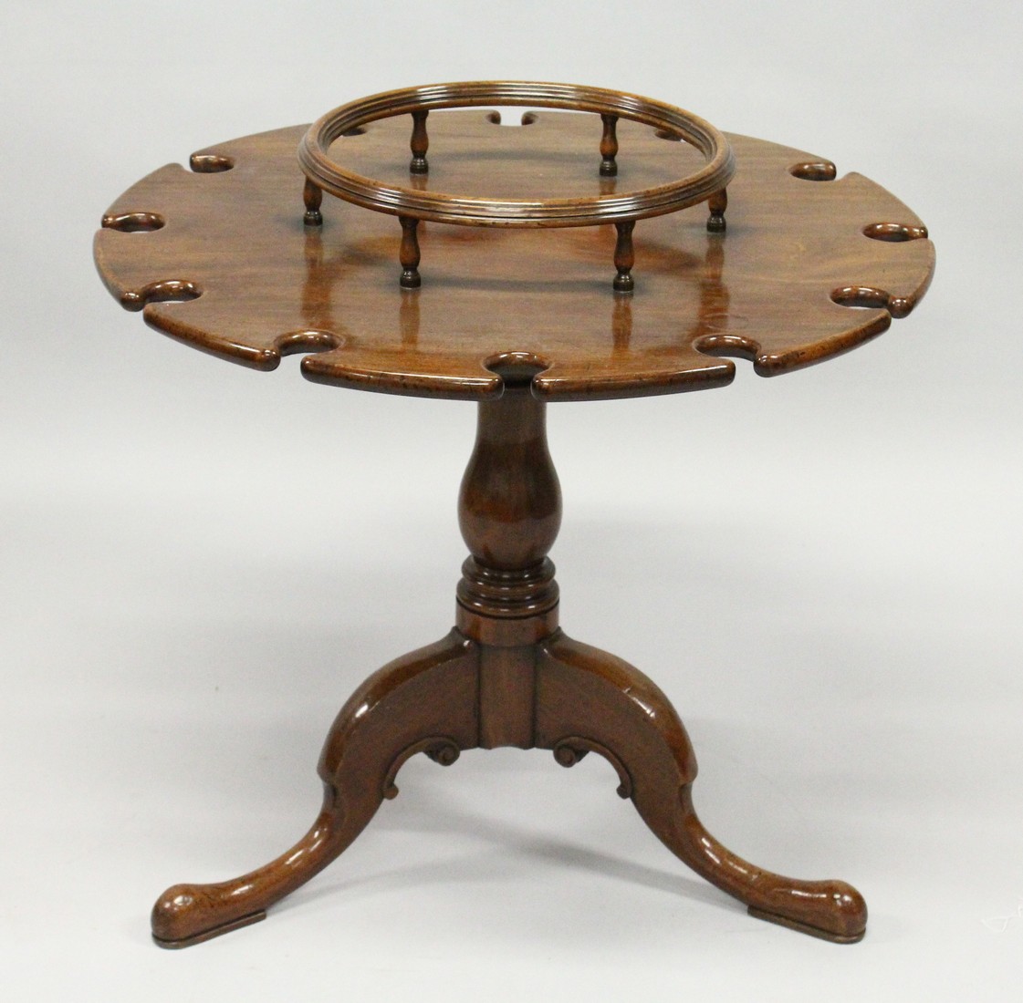 A GEORGE III STYLE MAHOGANY SHIP'S TRIPOD TABLE with centre section for bottles. The sides with