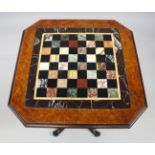 A GOOD 19TH CENTURY FIGURED WALNUT GAMES TABLE, having a square top with clipped corners, inset with