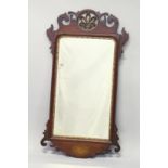 A GEORGE III DESIGN MAHOGANY AND INLAID FRET WORK FRAMED MIRROR, with pierced and carved cresting.