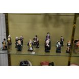 A group of small Royal Doulton figures, Doulton characters and others.