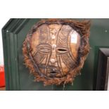 A Papua New Guinea turtle shell mask.