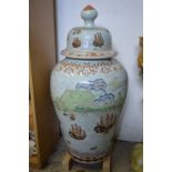 A large 20th century Chinese porcelain lidded urn decorated with European nautical scenes.