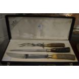 A cased carving set.