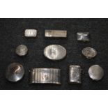 A collection of silver snuff boxes, card case, a vesta case etc.