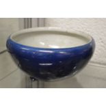 A Chinese blue pottery bowl (cracked).