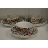 Three Chinese Imari tea bowls and saucers.