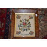 A Victorian embroidered picture of a bird and flowers, signed and dated M. J. Littledale 1839.