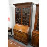 A George III mahogany bureau bookcase.