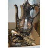 A decorative plated coffee pot and other items.