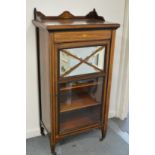 A Victorian rosewood and inlaid music cabinet.