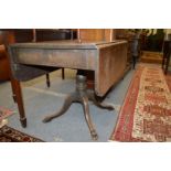 A mahogany pedestal Pembroke table.