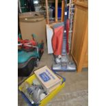 A Kirby Heritage vacuum cleaner with accessories.