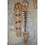 Two carved wood tribal totems.