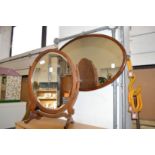 A dressing table mirror and a wall mirror.