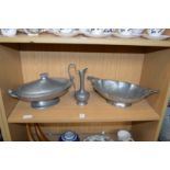 A pewter oval tureen and cover, a similar twin handled basket and a small ewer.
