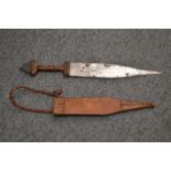 An African dagger with leather sheath.