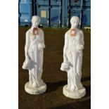 A pair of painted composite classical garden figurines.