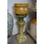 A pottery jardiniere and stand.