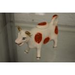 A Staffordshire cow creamer.