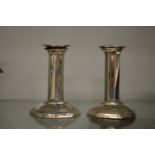 A pair of silver octagonal shaped candlesticks.