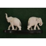 A pair of carved elephants.