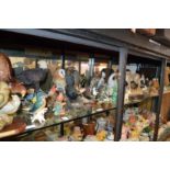 A large quantity of decorative figures of animals, birds, David Winter cottages etc.