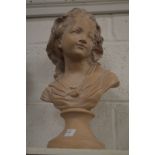 A plaster bust of a young girl.