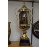 A large plated trophy cup.