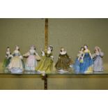 Eight Royal Doulton figurines.