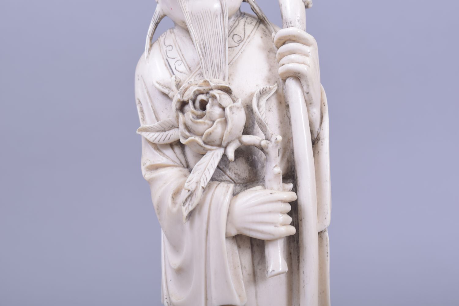 A CHINESE CARVED IVORY FIGURE OF A SAGE, holding a dragon staff, red seal to reverse, 30cm high. - Image 4 of 5