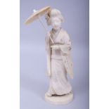 A JAPANESE MEIJI PERIOD CARVED IVORY OKIMONO - A GEISHA WITH PARASOL, signed to base, carved and