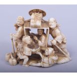 A JAPANESE MEIJI PERIOD CARVED IVORY OKIMONO, depicting two figure carrying a rickshaw with four