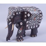 A LARGE INDIAN HARDWOOD AND INLAID MODEL ELEPHANT, inlaid with exotic timber and bone, 21cm high,