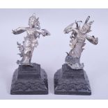 A PAIR OF 19TH CENTURY BURMESE SILVER MODELS OF DANCERS, both figures mounted to carved hardwood