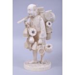 A LARGE JAPANESE MEIJI PERIOD CARVED IVORY OKIMONO - BASKET SELLER, the man holding a length of
