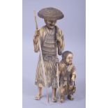 A JAPANESE MEIJI PERIOD CARVED IVORY OKIMONO - FISHERMAN, both with their catch and rods, 14.5cm