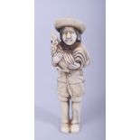 A JAPANESE MEIJI PERIOD CARVED IVORY NETSUKE - MAN AND COCKEREL, the man stood holding his