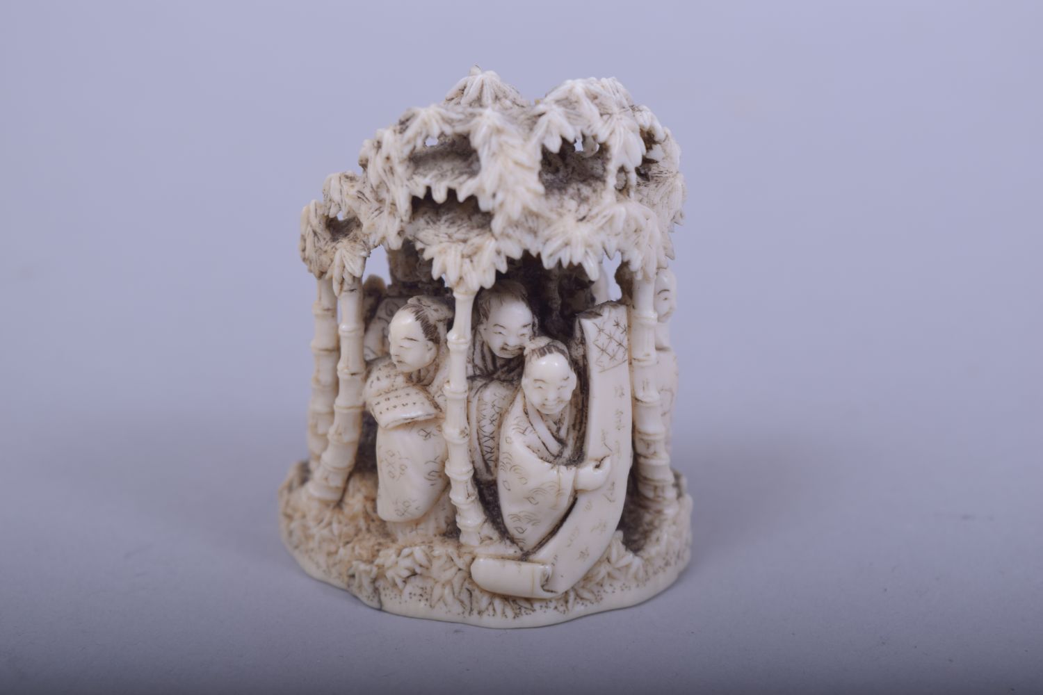A JAPANESE MEIJI PERIOD CARVED IVORY OKIMONO - NINE IMMORTALS under bamboo trees holding a scroll - Image 3 of 5