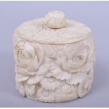 A JAPANESE MEIJI PERIOD CARVED IVORY BOX AND COVER, carved with chrysanthemum, 9.5cm high.
