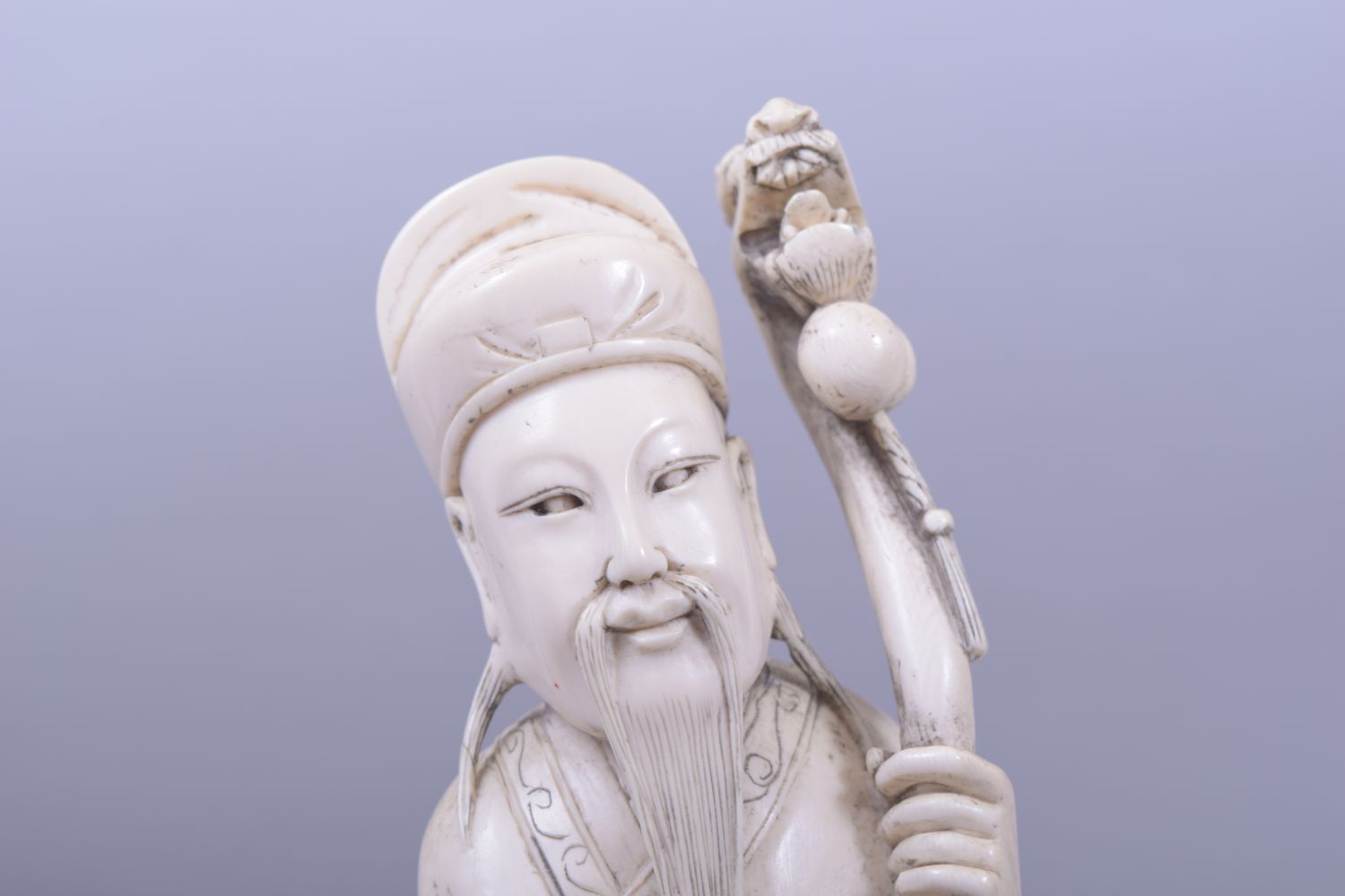 A CHINESE CARVED IVORY FIGURE OF A SAGE, holding a dragon staff, red seal to reverse, 30cm high. - Image 3 of 5