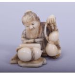 A JAPANESE MEIJI PERIOD CARVED IVORY NETSUKE - MAN AND GOURD, the sectional netsuke depicting a
